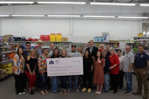 MISD Education Foundation posing with the U.S. LBM Humanitarian Award