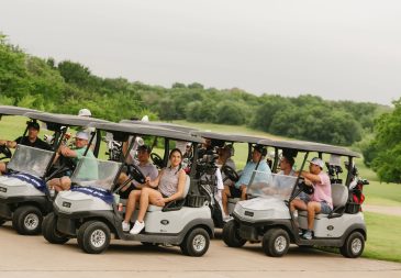 People riding golf carts at Midlothian Chamber of Commerce Southern Star Scramble