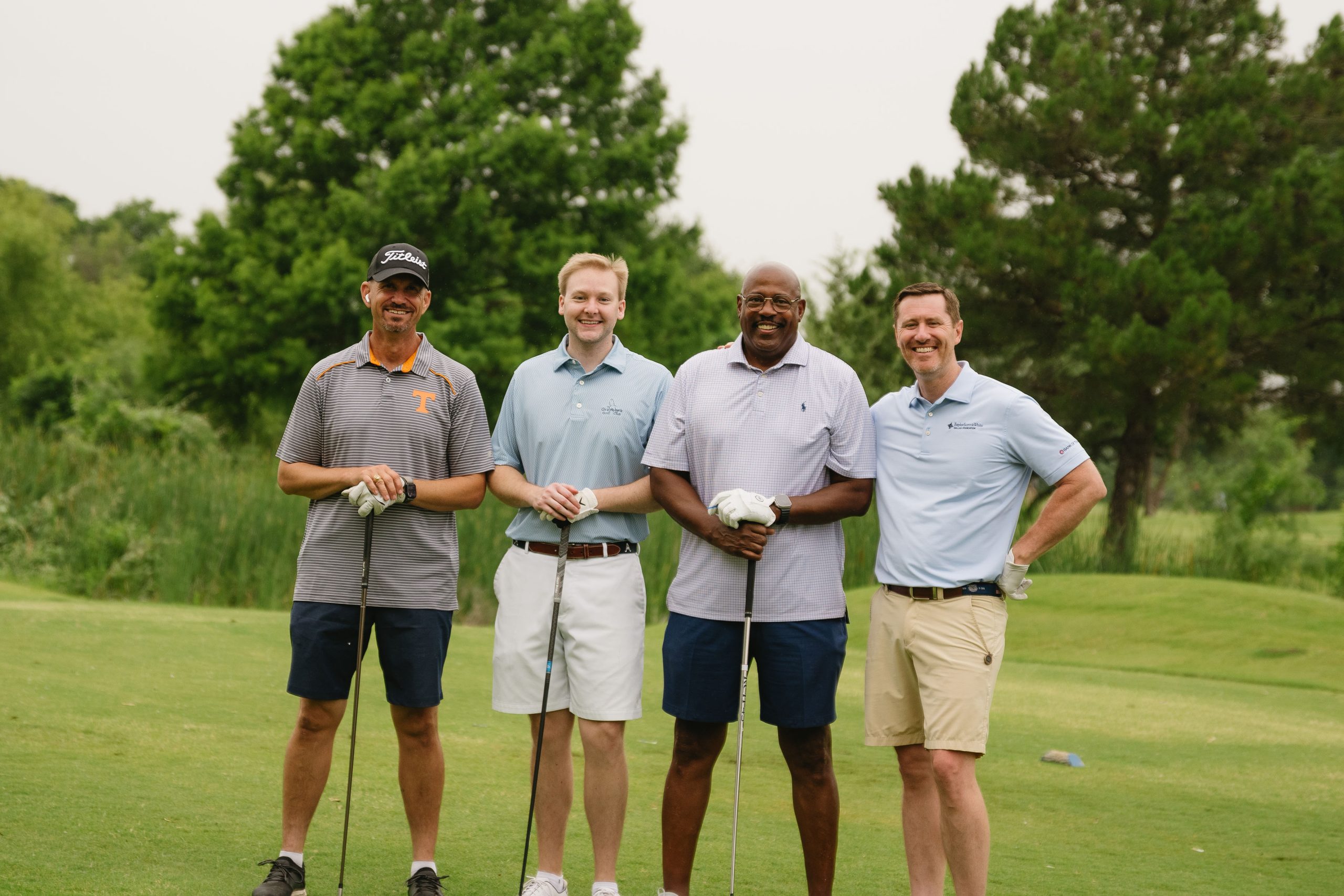 Group of men posing with golf clubs at Midlothian Chamber of Commerce Southern Star Scramble
