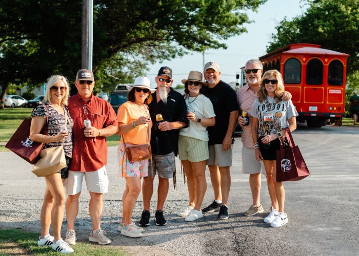 Chamber MidloFest group of attendees in front of the trolley