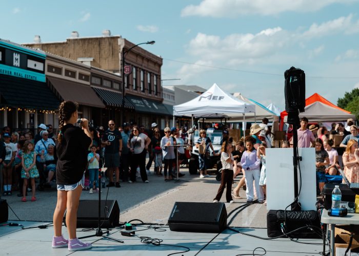Young girl singing at Chamber MidloFest