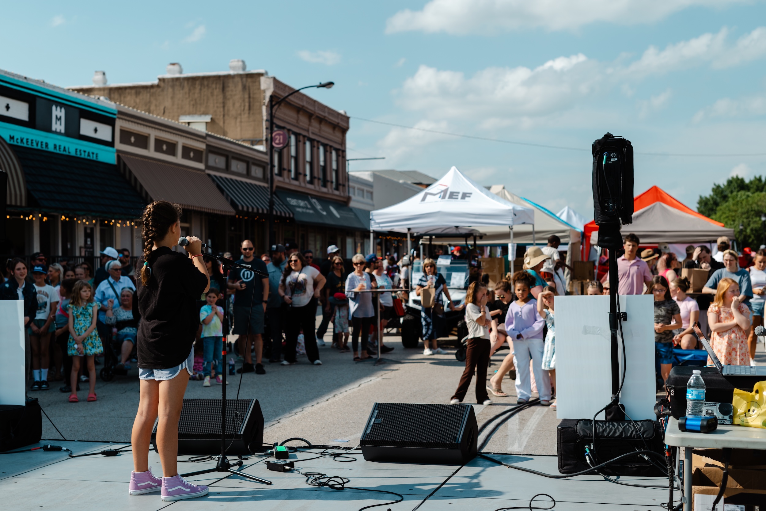 Young girl singing at Chamber MidloFest