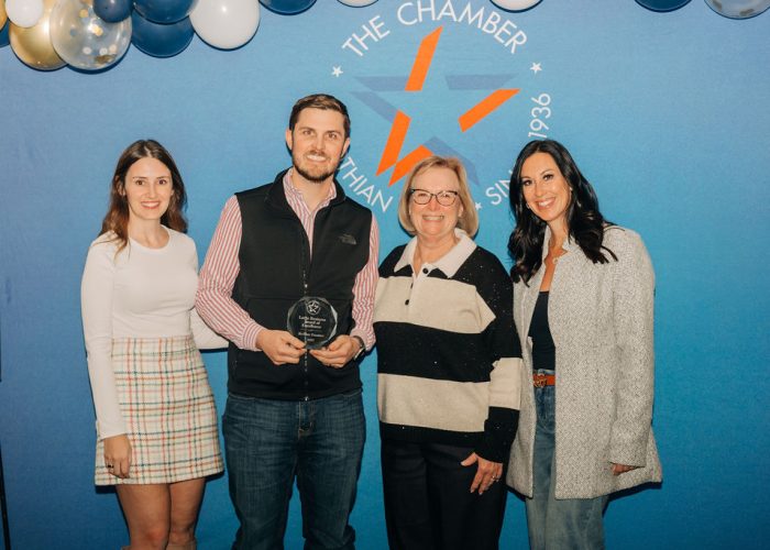 RE/MAX Frontier receiving Large Business of the Year award